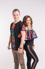 Fototapeta premium Funny couple dancing social dance. Kizomba or bachata or semba or taraxia , on white background. Social dance concept.
