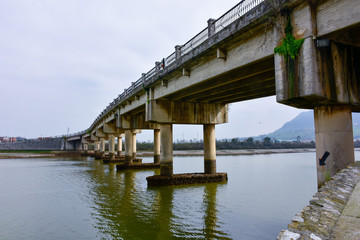 bridge crossing the greenish river