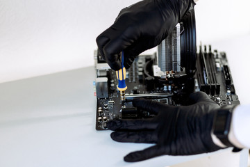 Computer components at the time of PC assembly. Installation ssd-m2. Motherboard, RAM, cooling system, SSD drive