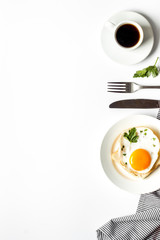 Fried eggs, coffee for breakfast on white table top view copy space