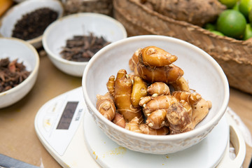 galangal for jamu traditional drink being weight