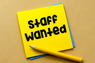 STAFF WANTED word written on a piece of paper.