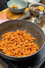 hand cooking turmeric and ginger for jamu herbal drink