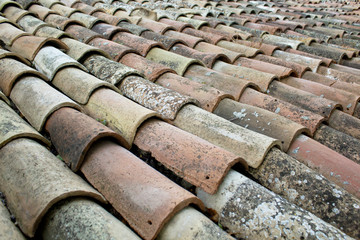 Tiles on old castle roof, architecture background. Brown roof tiles.