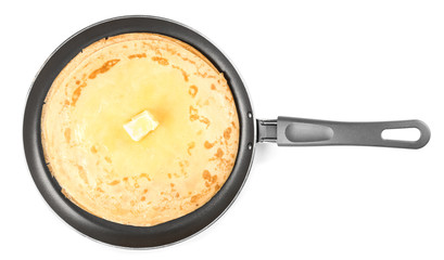 Frying pan with tasty blini on white background