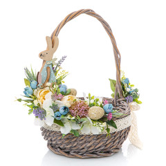 Fototapeta na wymiar Wicker basket with original floral decor and wide ribbon isolated on a white background
