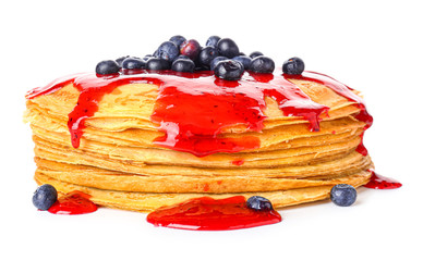 Tasty blini with berries on white background