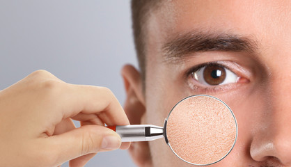 Man with dry skin visiting dermatologist, closeup