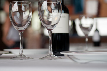 Restaurant table with crystal glasses and wine

