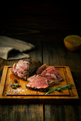 Roast beef steak with spices, seasonings and capers
