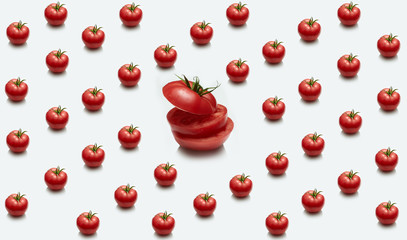 One large sliced tomato on the background of many tomatoes