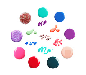 Set of different nail polishes on white background