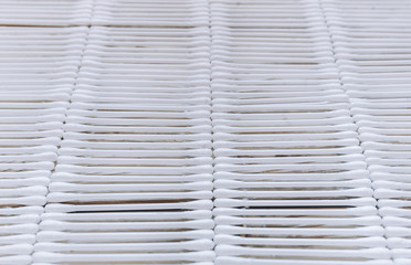 A lot of white cotton swabs on the background close-up. Medicine in for cleansing the face and ears. Concept of skin and body care. 