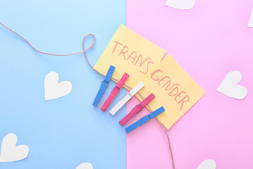 Papers with word TRANSGENDER on color background