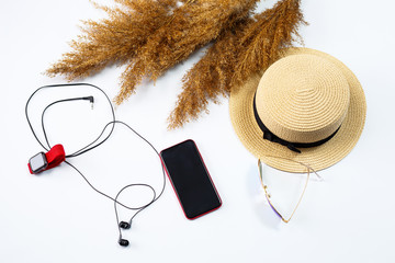 Female accessories lie collage with hat, watch, fashion glasses, mobile phone and earphones on a...
