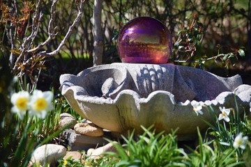 Gazing ball on bird bath