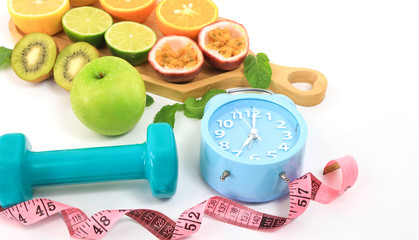 Intermittent Fasting  healthy food eating concept which Selective focus of  Dumbbell and  Alarm clock  of intermittent fasting on white background