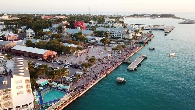 Beautiful 4K aerial drone shot of Mallory Square in Key West, Florida during sunset.