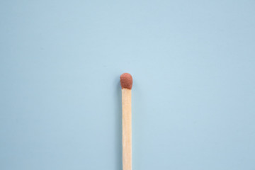  Match on a blue background close-up with text space. Flat lay composition