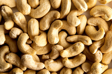Lay flat cashew nuts dry fruits against a white background for a wall paper