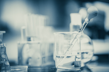 Different laboratory glassware in chemical science laboratory.