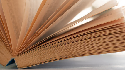 Closeup  The ridge of the old books in brown, vintage style. Concept Articles about old knowledge or memories.