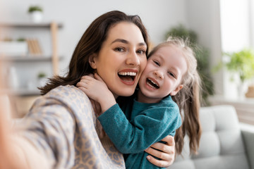mom and child are having fun at home