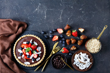 Healthy chocolate tart with strawberries on top