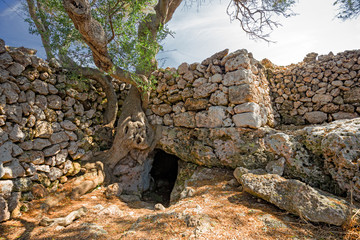 Panoramic view of the wall, of the archaeological site of Naveta des Tudons on the island of Menorca in Spain.