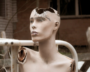 Old abandoned broken sad mannequin. Post-apocalyptic future. Old abandoned building. Hopelessness...