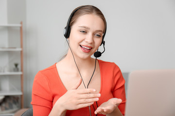 Young woman video chatting at home