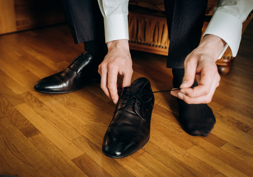 man take his wedding shoes
