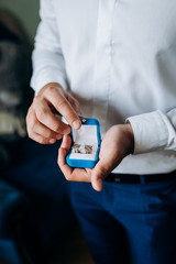man holding a wedding rings