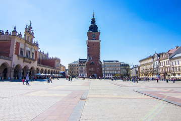 Naklejka premium The Cloth Hall and Town Hall Tower with clock in the Main Square (Rynek Glowny), Old Town of Krakow