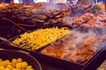 Sausage stall at the Easter market at Rynek Glowny square in Krakow. Grilled street food, food concept