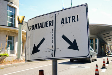 Italy, Como city, 19 September 2017, "Ponte Chiasso" customs, road sign indicating border crossing