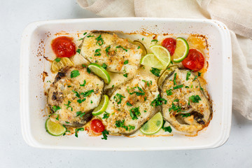 Homemade cod in butter sauce, with lime, tomato, parsley and garlic.