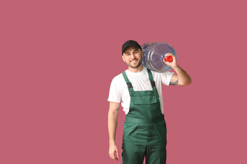 Delivery man with bottle of water on color background