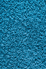 Fototapeta na wymiar Texture and background of blue carpet. Vertical color photo. 