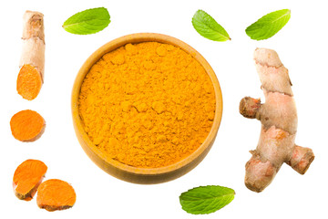 Turmeric powder with turmeric root isolated on white background. Top view.