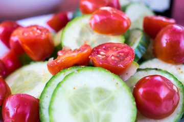 CU cucumber and tomato on plate, South Africa