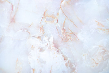 Fototapeta na wymiar White and pinkish marble stone closeup shot. Texture, design and backdrop concept