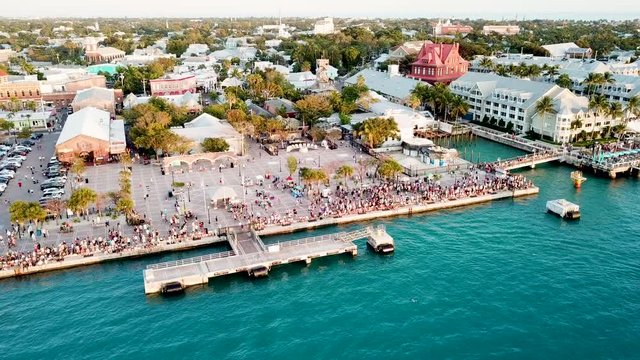 Beautiful 4K aerial drone shot of Mallory Square in Key West, Florida during sunset.