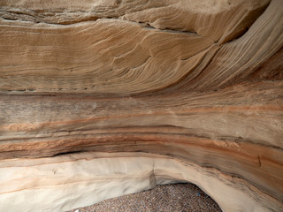 Geological sandstone outcrop, close-up of an abstract wavy pattern