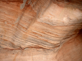 Geological sandstone outcrop, close-up of an abstract wavy pattern