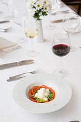 White buffalo mozzarella cheese with red tomatoes