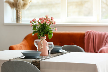 Bouquet of flowers on table in dining room