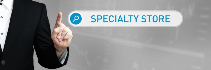 Specialty Store. Man in a suit points a finger at a search box. The word Specialty Store is in the search. Symbol for business, finance, statistics, analysis, economy