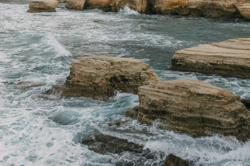 wet stones near water of mediterranean sea