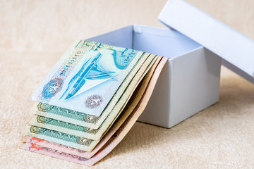 Many UAE Dirham Banknotes in white gift box. Studio Shot.